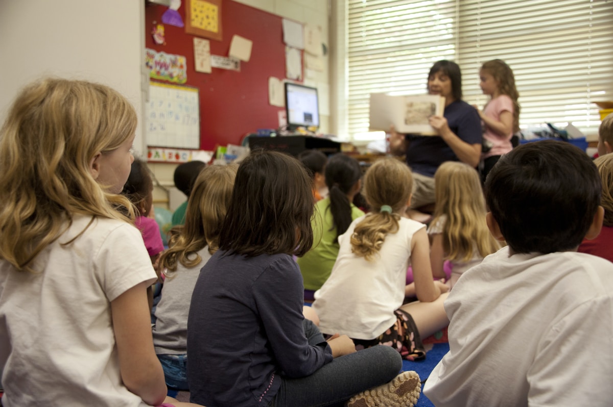 Teacher with student during literacy assessment